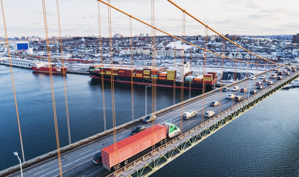 bridge above a container ship docked
